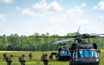 Soldier loading into a UH-60 ready to conduct Airborne operation