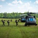 Soldier loading into a UH-60 ready to conduct Airborne operation