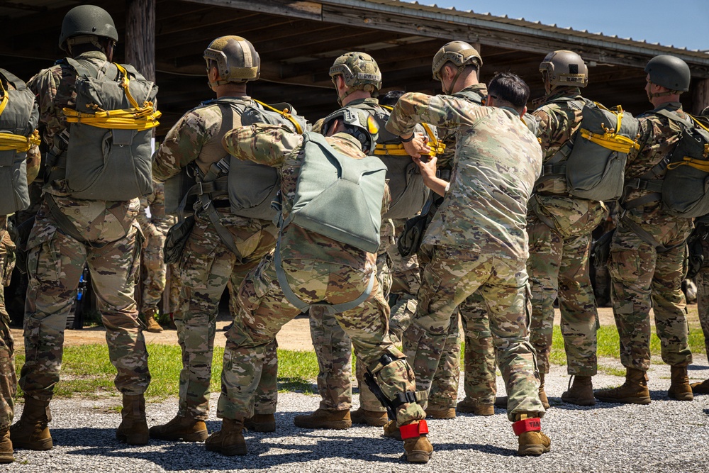 Jump Master inspects parachutes during an airborne operation