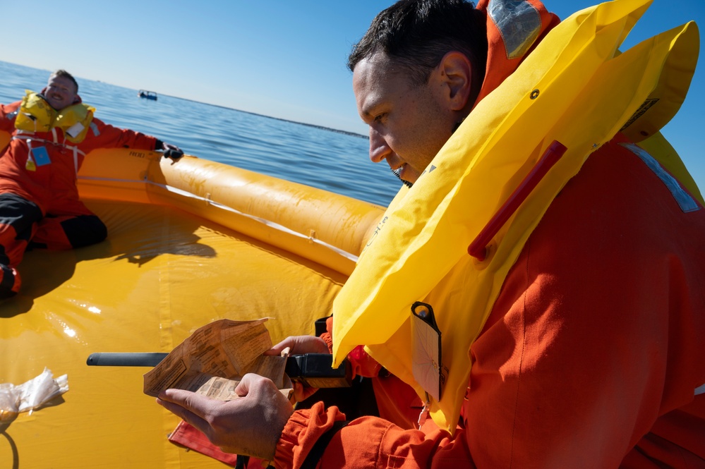 SERE specialists test aircrew members' water survival skills in freezing temperatures