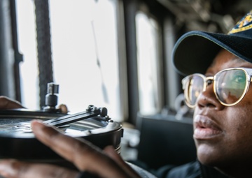 USS Mitscher (DDG 57) junior officer stands watch in ship bridge