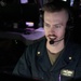 USS Mitscher (DDG 57) officer stands TAO watch in ship CIC