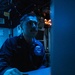 USS Mitscher (DDG 57) Sailor stands watch in sonar control room