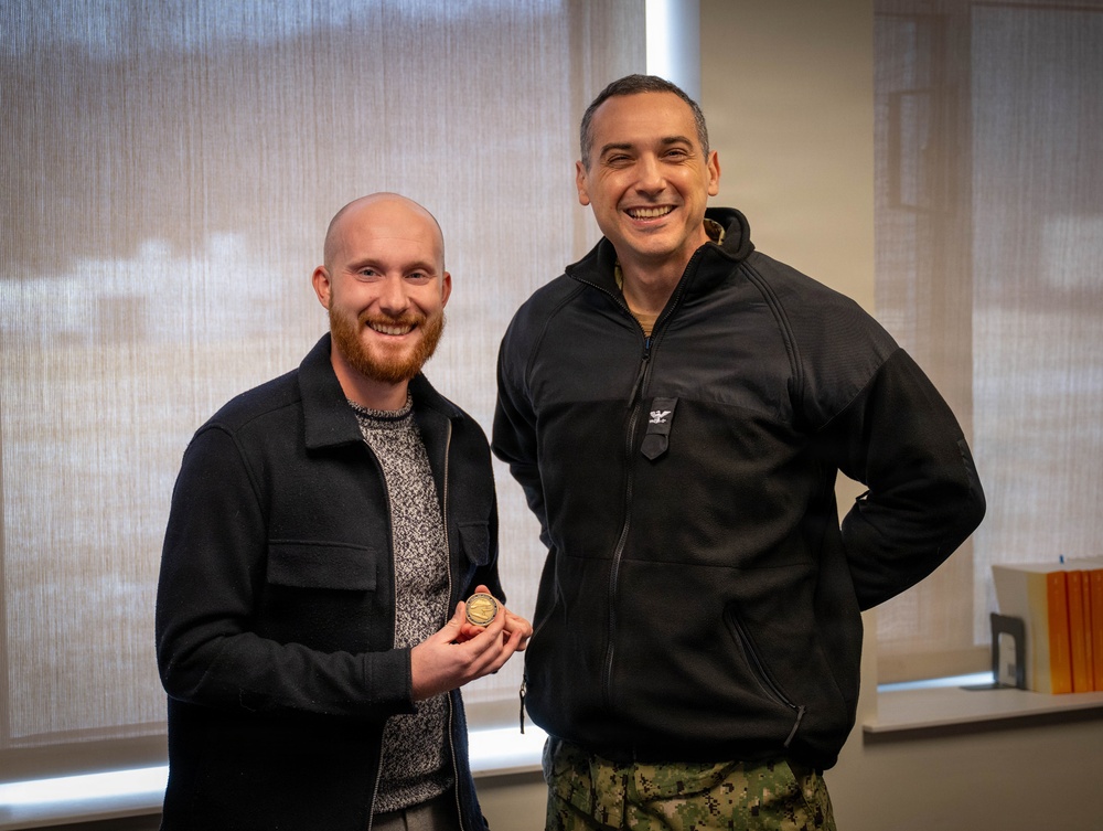 Carderock Administrative/Technical Specialist Landon Transeau receives command coin