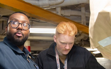USS Ronald Reagan Sailors and Contractors Conduct Maintenance