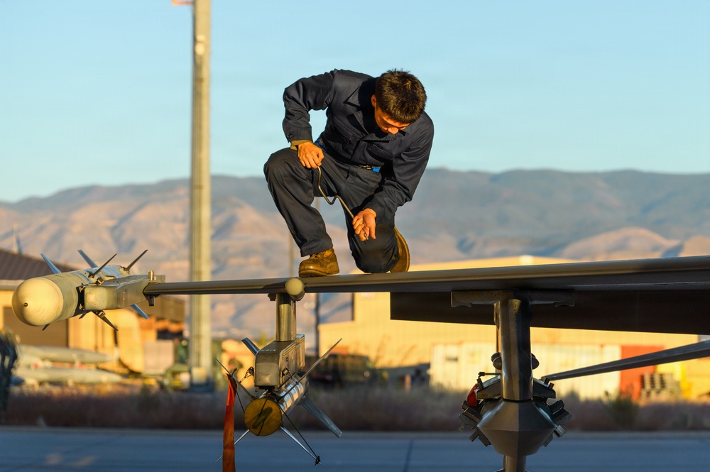 311th Aircraft Maintenance Unit works on F-16 Fighting Falcons day and night