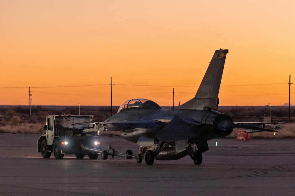 311th Aircraft Maintenance Unit works on F-16 Fighting Falcons day and night