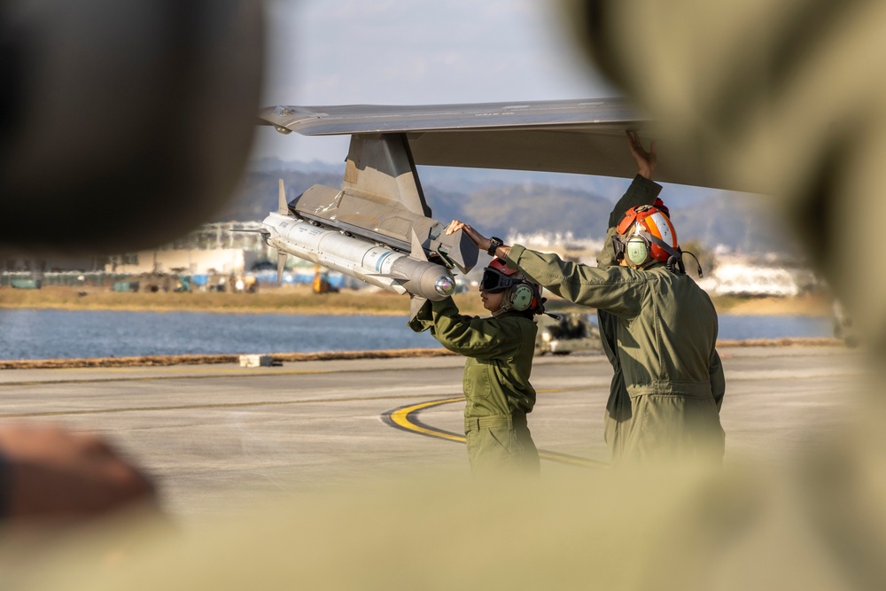 U.S. Marines perform ordnance loading and refueling
