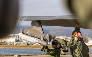 U.S. Marines perform ordnance loading and refueling