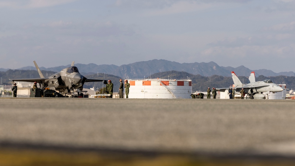 U.S. Marines perform ordnance loading and refueling