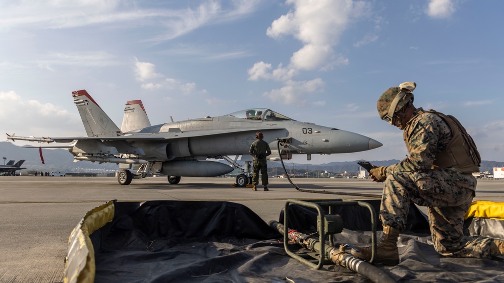 U.S. Marines perform ordnance loading and refueling