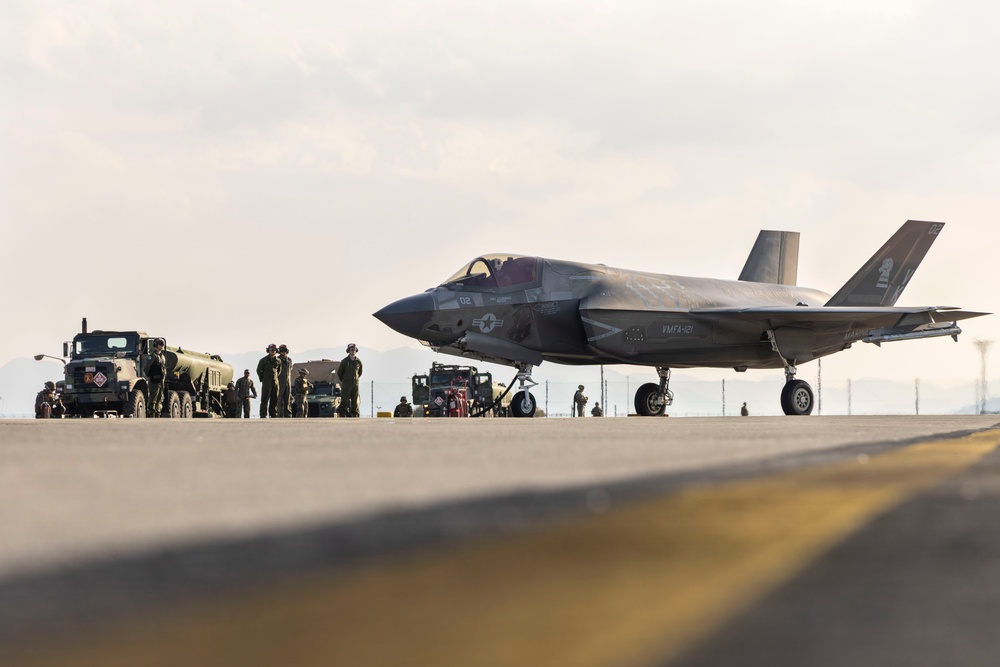 U.S. Marines perform ordnance loading and refueling