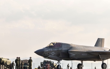 U.S. Marines perform ordnance loading and refueling