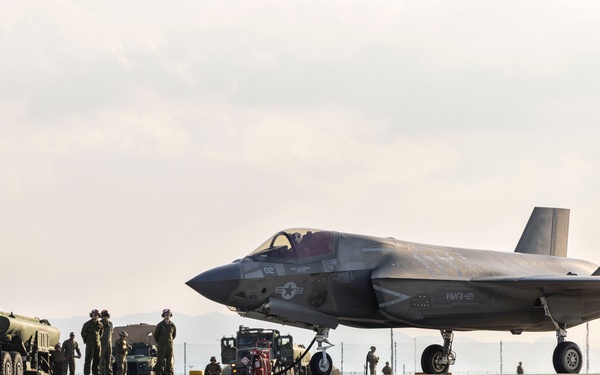U.S. Marines perform ordnance loading and refueling