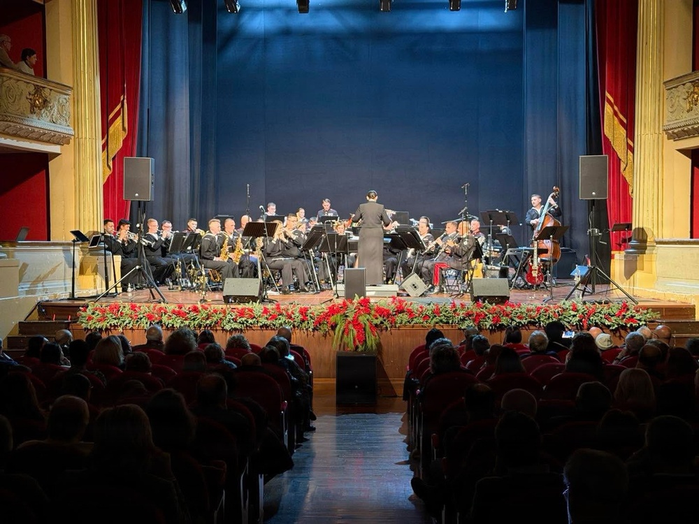 LCDR Luslaida "Tuttie" Barbosa conducts the U.S. Naval Forces Europe and Africa Band Holiday show at Teatro Garibaldi in Santa Maria Capua Vetere, Italy