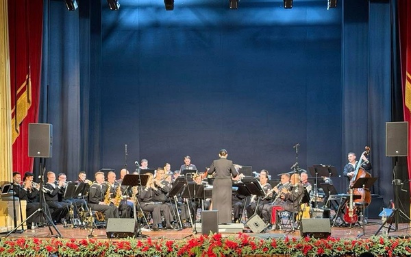 LCDR Luslaida "Tuttie" Barbosa conducts the U.S. Naval Forces Europe and Africa Band Holiday show at Teatro Garibaldi in Santa Maria Capua Vetere, Italy