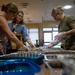 Spangdahlem Air Base volunteers fill over 450 bags of cookies to give to Airmen