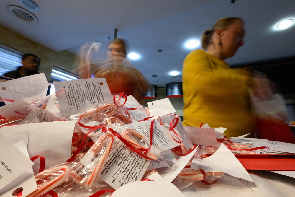 Spangdahlem Air Base volunteers fill over 450 bags of cookies to give to Airmen