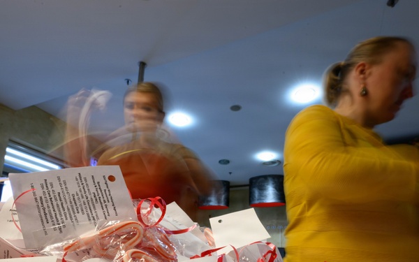 Spangdahlem Air Base volunteers fill over 450 bags of cookies to give to Airmen