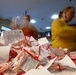 Spangdahlem Air Base volunteers fill over 450 bags of cookies to give to Airmen