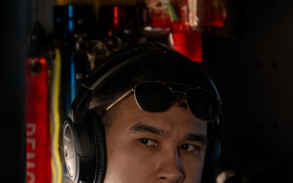 U.S. Coast Guard aircraft soar over Mount Rushmore