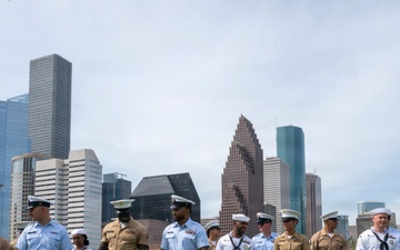 Service members from all branches walk together for Fleet Week promotion