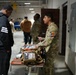 Tactical Care: 1st Armored Division Soldier Demonstrates Field Medical Equipment to Sun Bowl Players