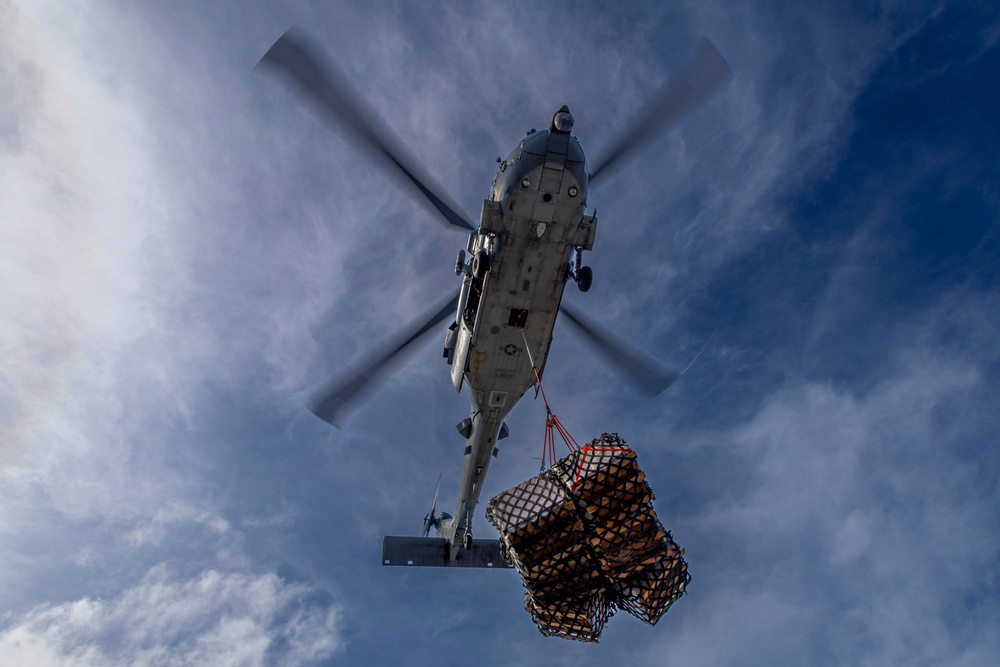 Abraham Lincoln conducts a replenishment-at-sea with the Henry J. Kaiser