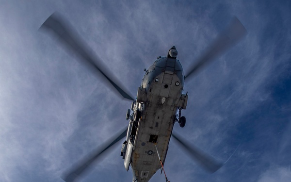 Abraham Lincoln conducts a replenishment-at-sea with the Henry J. Kaiser