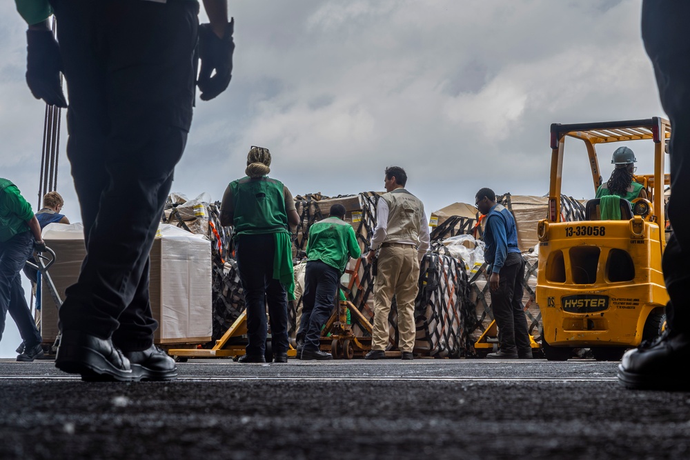 Abraham Lincoln conducts a replenishment-at-sea with the Henry J. Kaiser