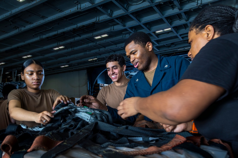 Abraham Lincoln conducts a replenishment-at-sea with the Henry J. Kaiser