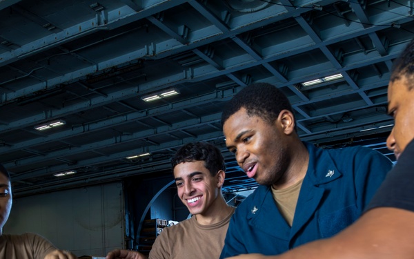 Abraham Lincoln conducts a replenishment-at-sea with the Henry J. Kaiser