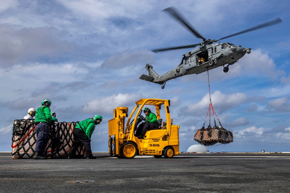 Abraham Lincoln conducts a replenishment-at-sea with the Henry J. Kaiser