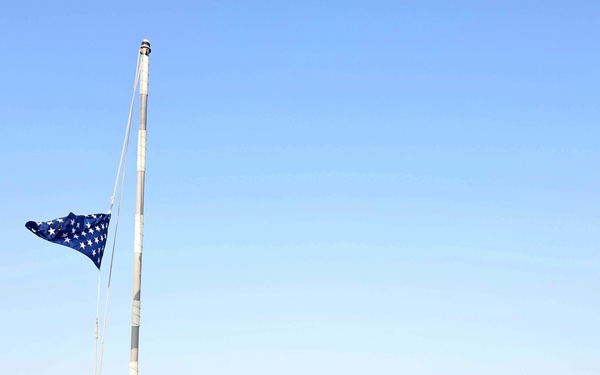 USS Roosevelt (DDG 80) Sailor Conducts Morning Colors in Manama, Bahrain