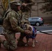 A Mississippi Army National Guard Soldier pets a dog in Washington, D.C.