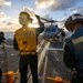 U.S. Sailors Present Chock and Chain to an MH-60R Sea Hawk Helicopter