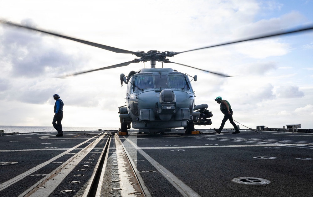 U.S. Sailors Chock and Chain an MH-60R Sea Hawk Helicopter