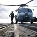U.S. Sailors Prepare to Chock and Chain an MH-60R Sea Hawk Helicopter