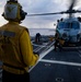 U.S. Sailors Remove Chocks and Chains From an MH-60R Sea Hawk Helicopter
