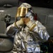 U.S. Sailor Dons Fire Proximity Gear in the Hangar Bay