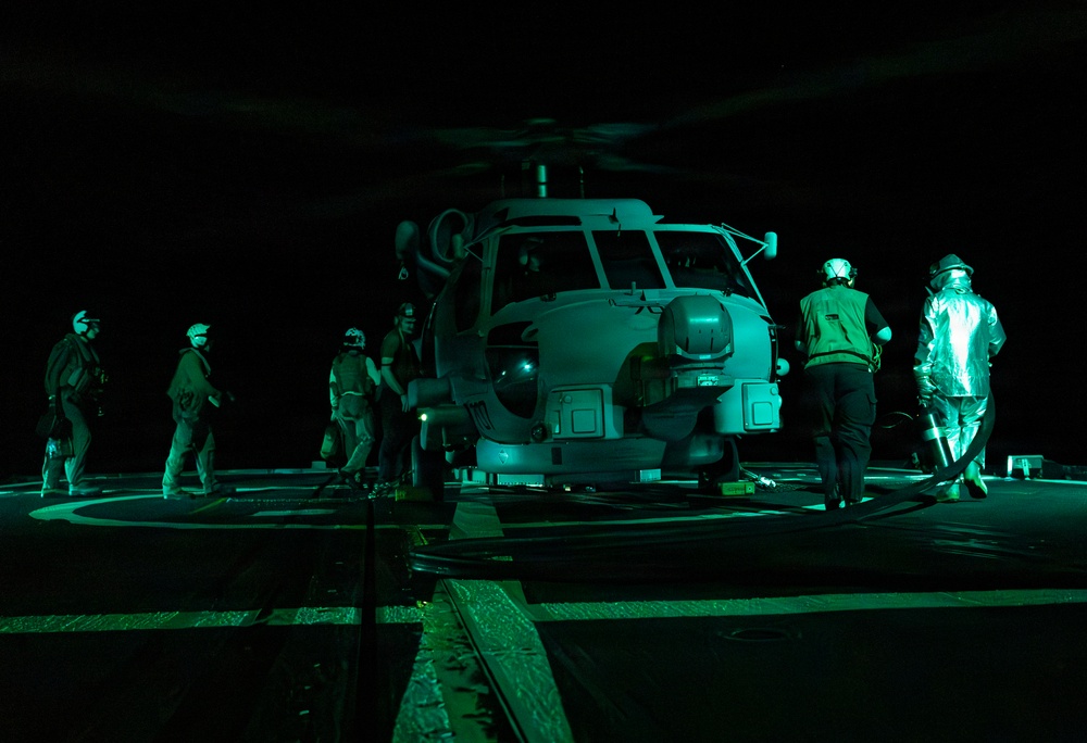 U.S. Sailors Refuel an MH-60R Sea Hawk, Attached to Helicopter Maritime Squadron 72