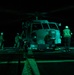 U.S. Sailors Refuel an MH-60R Sea Hawk, Attached to Helicopter Maritime Squadron 72