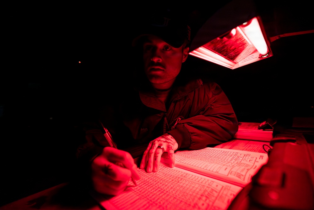 U.S. Sailors Chock and Chain an MH-60R Sea Hawk, Attached to Helicopter Maritime Squadron 72