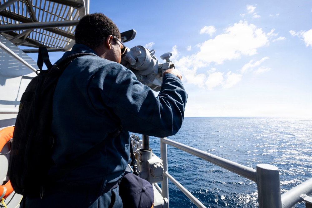 A U.S. Sailor Stands Lookout on the Bridge Wing
