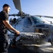 U.S. Sailor Washes an MH-60R Sea Hawk Helicopter