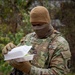 A Mississippi Army National Guard Soldier receives food while on patrol in Washington, D.C.