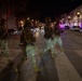 Mississippi National Guard service members cross the street at night in Washington, D.C.
