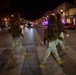 Mississippi National Guard service members cross the street at night in Washington, D.C.