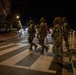 Mississippi National Guard service members use a crosswalk at night in Washington, D.C.
