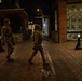 Mississippi National Guard service members walk on patrol at night in Washington, D.C.